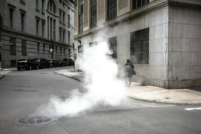 steam coming out of a manhole cover in Manhattan